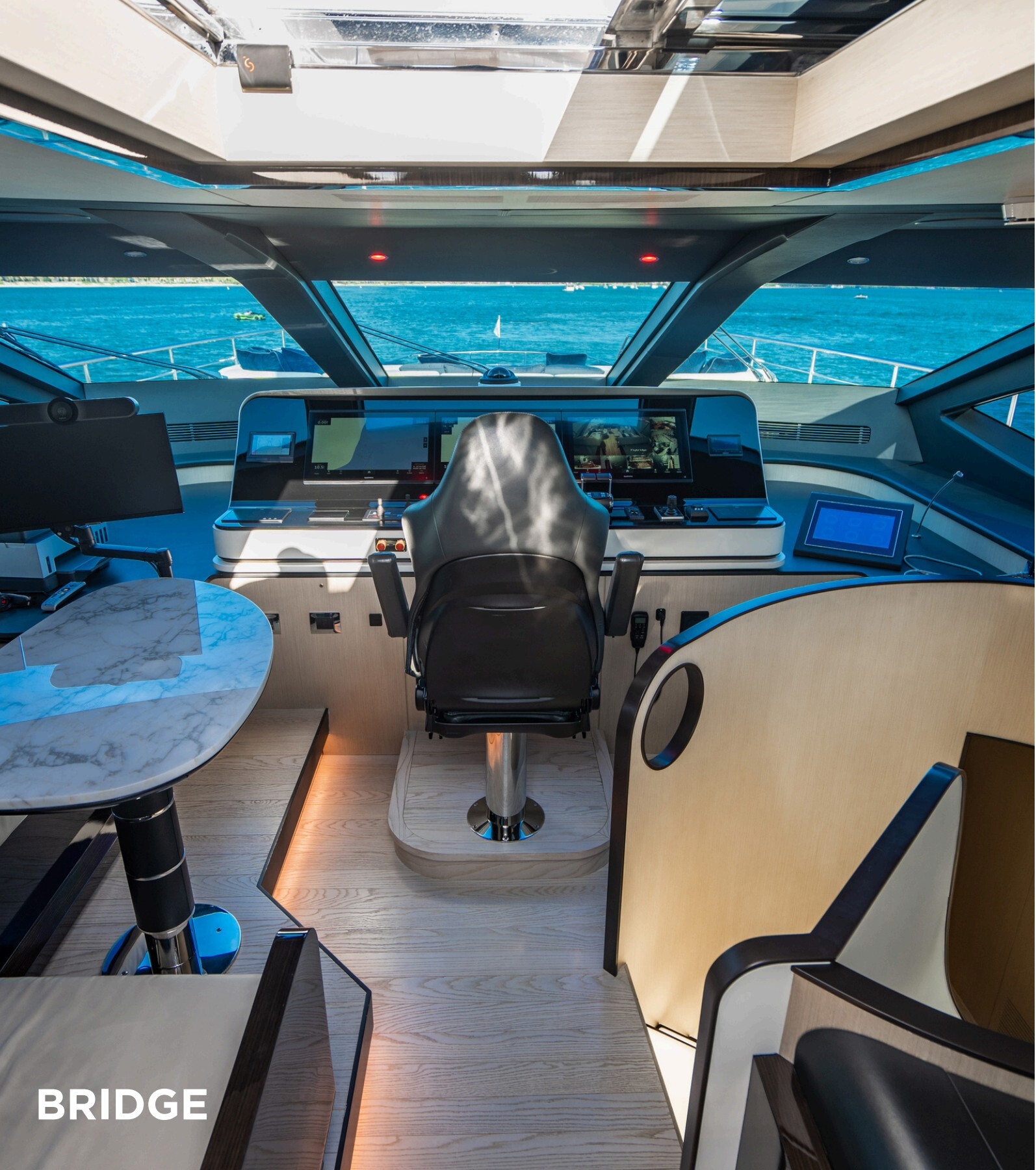 Yacht bridge helm station with navigation screens