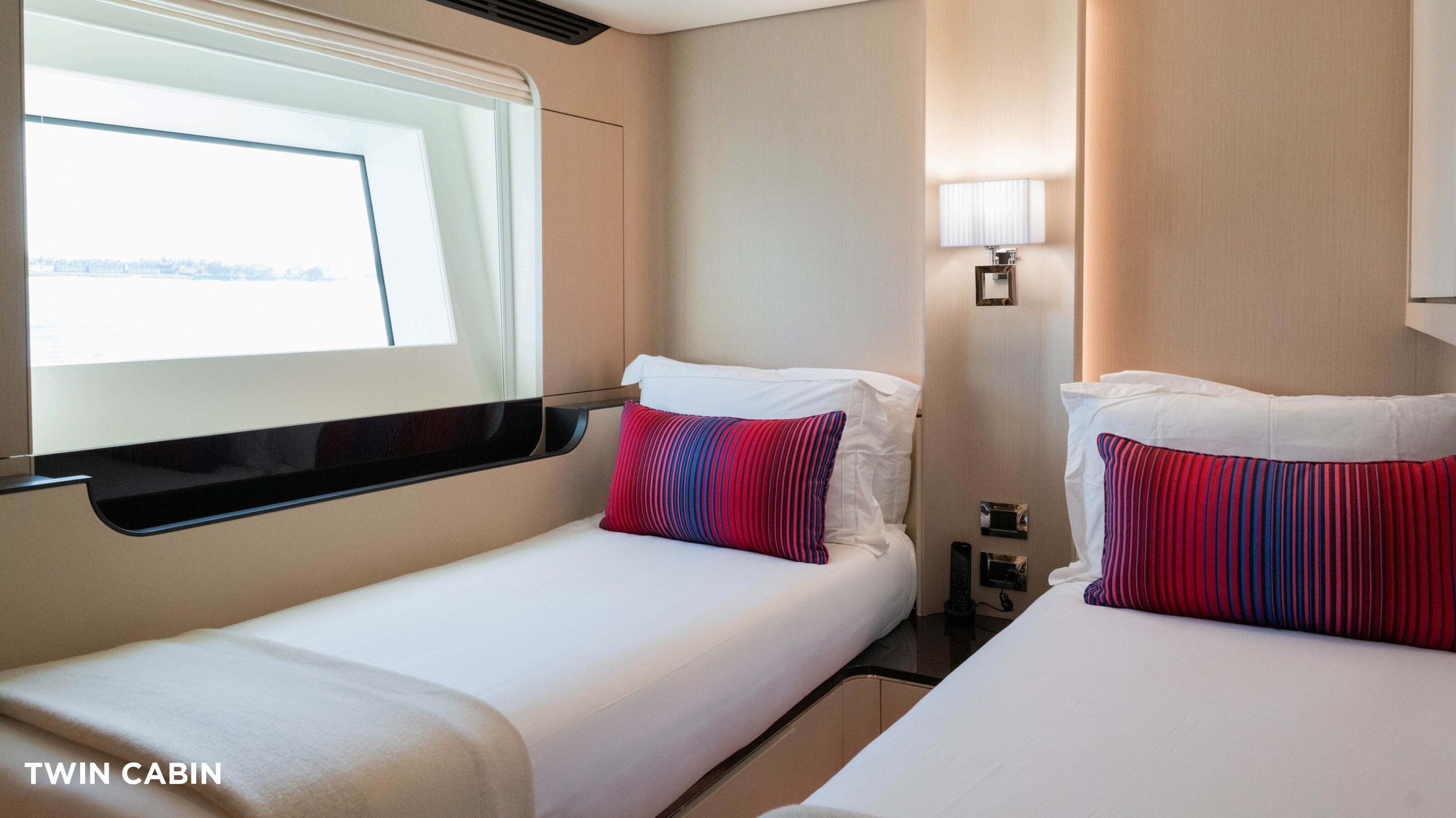 Twin cabin with two single beds and ocean view